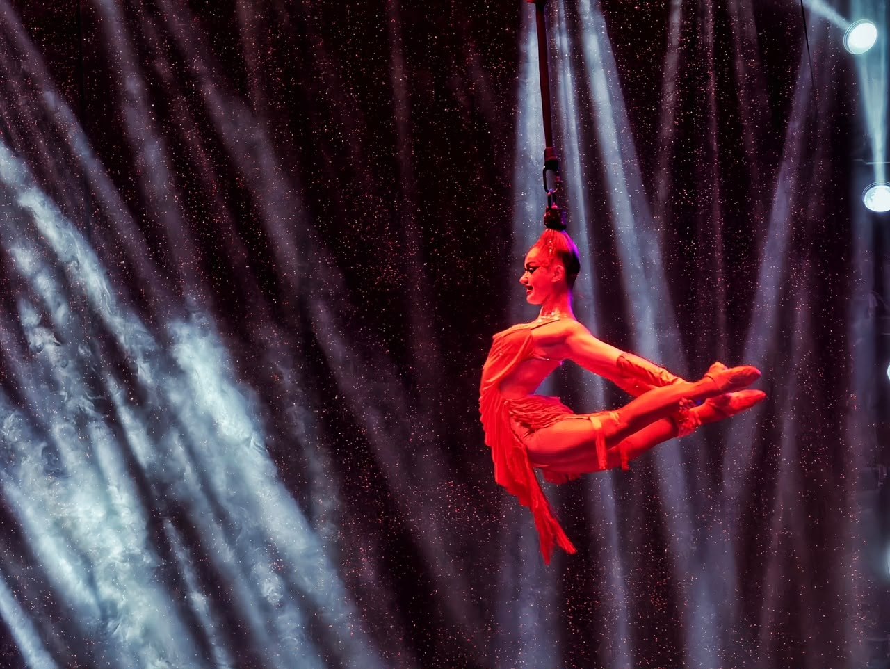Milena Prudtskikh performing her signature hair hang act